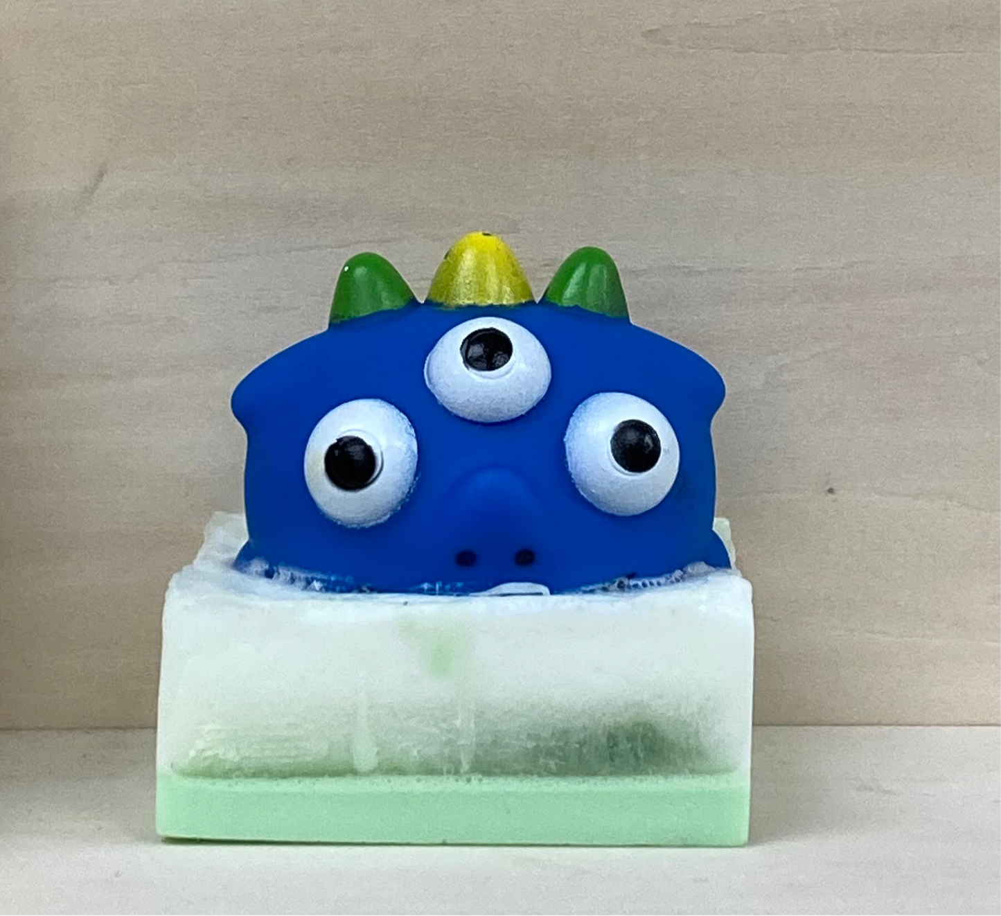 Dinosaur Squirt Toy Monster on Glow-in-the-Dark Soap
Prehistoric Bath Time Adventure!
 Price: $10
 Description:
Make bath time a roaring good time with this glow-in-the-dark glycerin soap featuring a Dinosaur Squirt Toy Monster! Infused with the tropical, fruity Monkey Farts scent, this soap turns every bath into a glowing prehistoric adventure.
Why You’ll Love It:
Dinosaur Squirt Toy Monster: A fun surprise that makes bath time exciting.
Glow-in-the-Dark Magic: Adds an extra splash of fun in the tub.