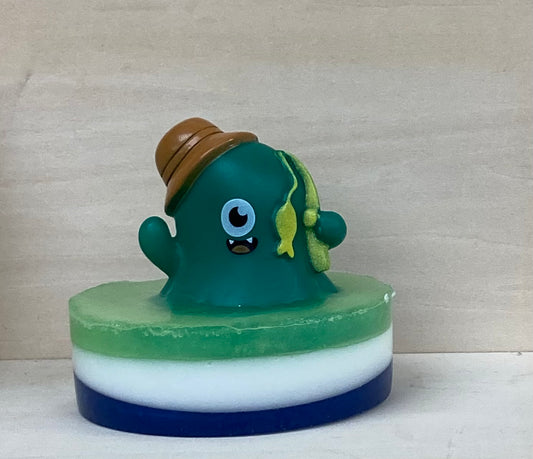 Meet Otto – The Fishermonster of the Bubbling Seas!
Grab your fishing pole (or just your rubber ducky) because Otto is ready to cast his line and reel in some fun! This friendly monster loves to fish, and there’s no better fishing spot than the soapy, sudsy waters of your bathtub! With his big grin and love for adventure, Otto is always on the lookout for the biggest catch of the day—whether it’s a toy boat, a handful of bubbles, or just a good time!
And what’s that? The air smells like Candy Crush! That’