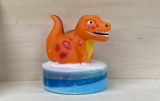 Dinosaur Squirt Toy on a bar of Glow in the Dark Soap
Bath Time Fun with a Dinosaur Twist!
Price: $10
Description:
Bring prehistoric excitement to bath time with this glow-in-the-dark Monkey Farts scented glycerin soap featuring a dinosaur squirt toy! The fruity, tropical scent and glowing design make every bath an adventure.
Dinosaur Fun: Each bar includes a Dinosaur squirt toy for added excitement.
Glow-in-the-Dark: Lights up the tub for a magical, fun-filled bath.
Monkey Farts Scent: A playful name w