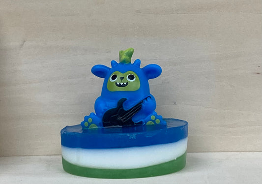 Rock Out with Axel the Guitar-Shredding Dino Bath Buddy!
Make bath time a head-banging concert with Axel, the Guitar-Shredding Dino Bath Buddy! This energetic, guitar-loving dino is ready to turn your tub into the ultimate rock ‘n’ roll stage. Scented like sweet Fruit Loops, Axel rocks out atop a handcrafted bar of nourishing shea butter and glycerin soap, bringing fun and a fruity fragrance to every bath.
Features:
Handcrafted shea butter and glycerin soap
Exciting Fruit Loops fragrance
Playful guitar-s