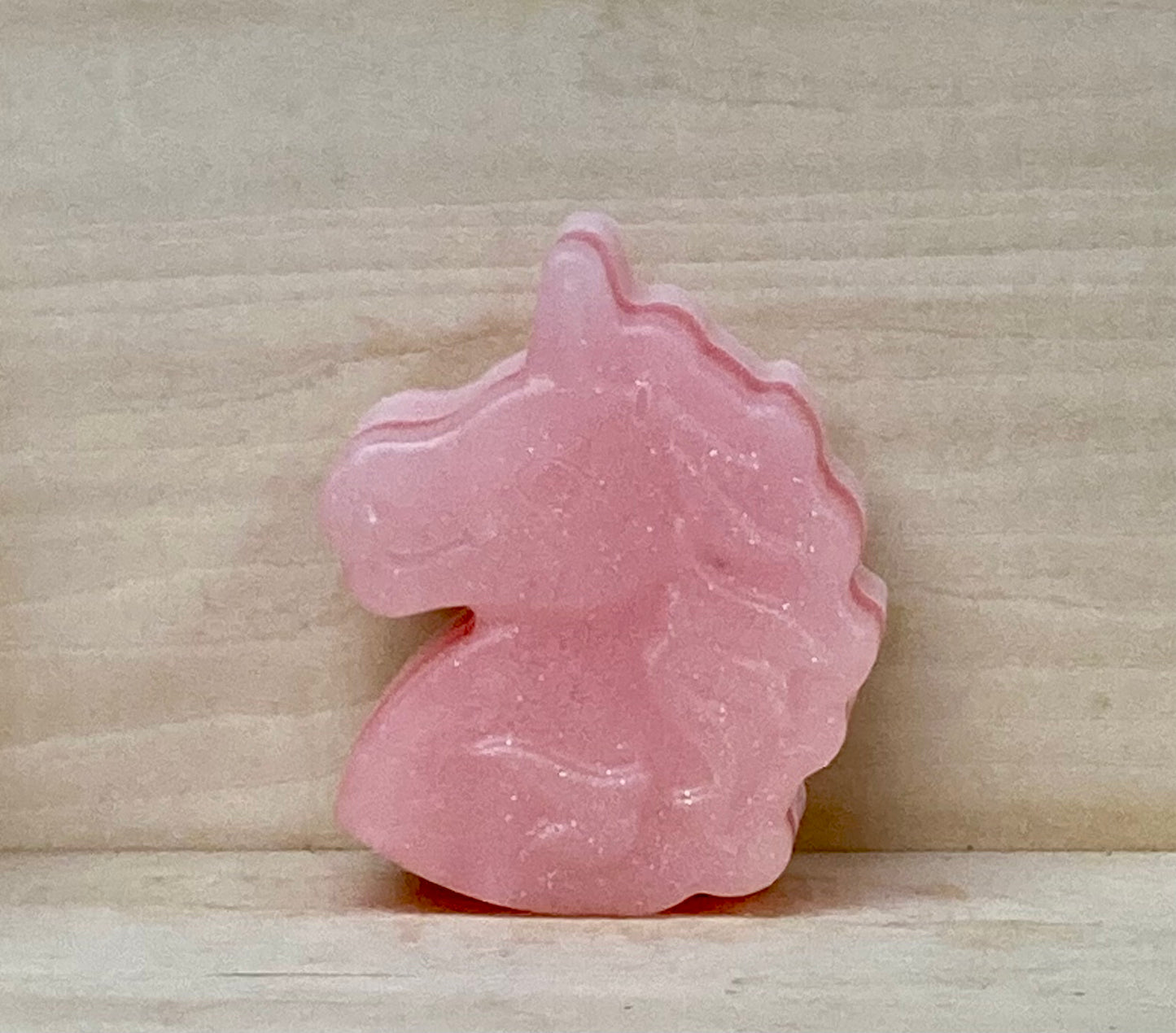 Glow-in-the-Dark Pink Unicorn Soap – $5
Bubble Gum Scented | Shea Butter & Glycerin Soap | With Glitter
Turn bath time into a glittery, glowing adventure with this pink unicorn soap that shines bright in the dark! Perfect for kids or anyone who loves a little extra magic, this whimsical bar is full of fun and sparkle.
Scented with sweet Bubble Gum and crafted with a moisturizing blend of shea butter and glycerin, each soap is gentle on skin and a joy to use.