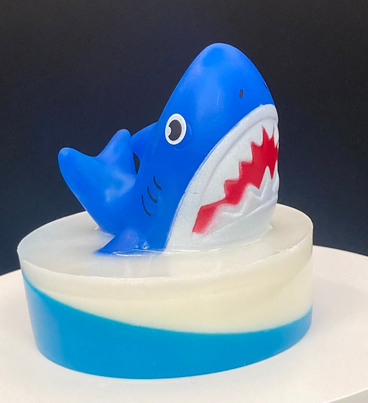 Shark Finger Puppets on a bar of Shea Butter and Glycerin Soap