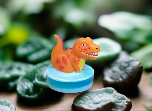 Dinosaur Squirt Toy on a Bar of Glow in theDark Candy Crush Scented Glycerin Soap