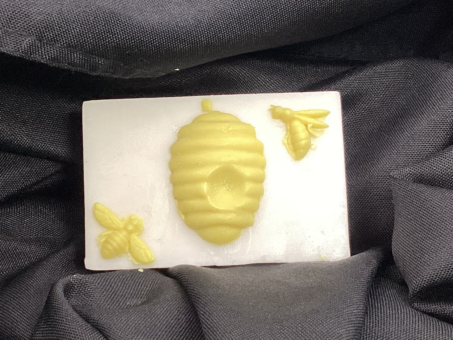  This is a 4 oz bar of Almond and Honey scented Goats Milk and Soap decorated with bees and a hive.

Each item is individually made and may appear different from the photo.
