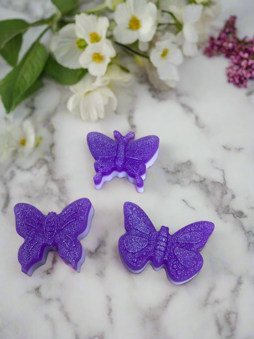 What little girl doesn't love glitter, purple and butterflies?  This soap has it all! 

This is a butterfly shaped bar of shea butter and glycerin soap with glitter!  The scent is Lavender.  A bar fit for your princess.

These would make a wonderful favor for a Birthday party or Baby shower.