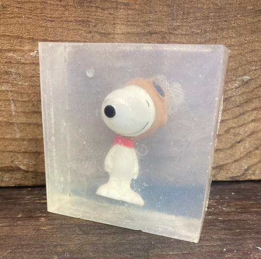 Snoopy toy in a bar of Candy Crush Scented Glycerin Soap

I was so excited to find these.  The toys come in several different poses, so they may vary from the photo.  

