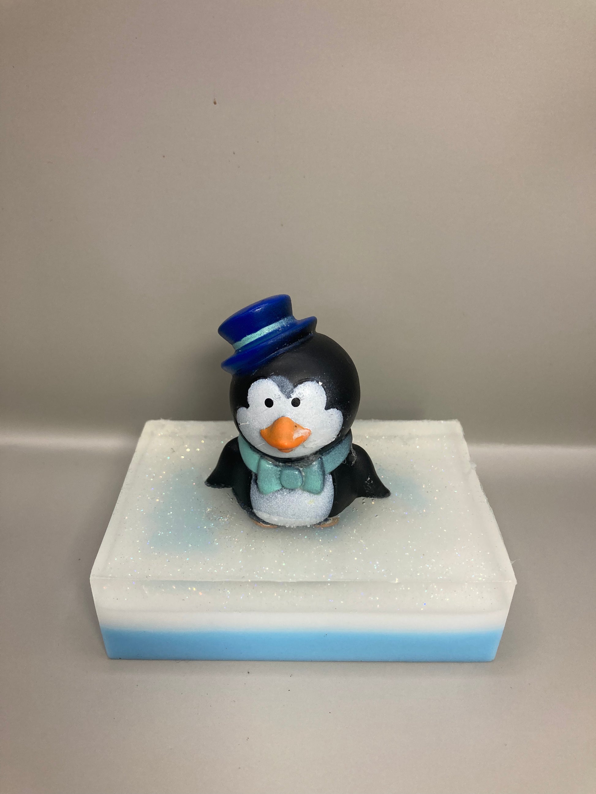 This adorable penguin toy is sitting atop a bar of White Christmas scented Shea Butter and Glycerin Soap!  

This would make a perfect stocking stuffer!

 

Each item is individually made and may appear different from the photo