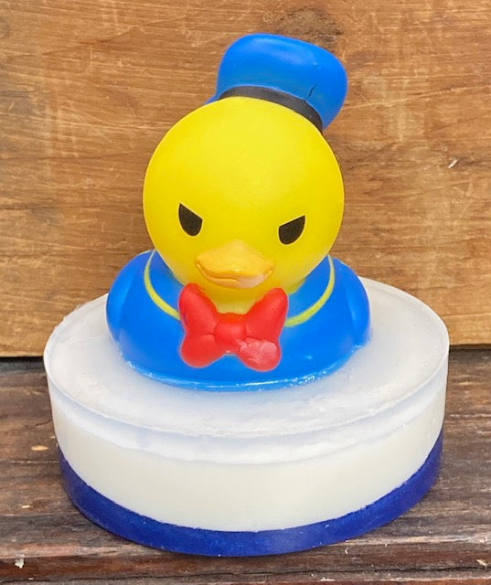 Donald Duck Rubber Duck sits atop a  Shea Butter and Glycerin soap.  The scent is Candy Crush.  These would make a wonderful Birthday or Baby Shower Favor!  $8  Each item is individually made and may appear different from the photo.