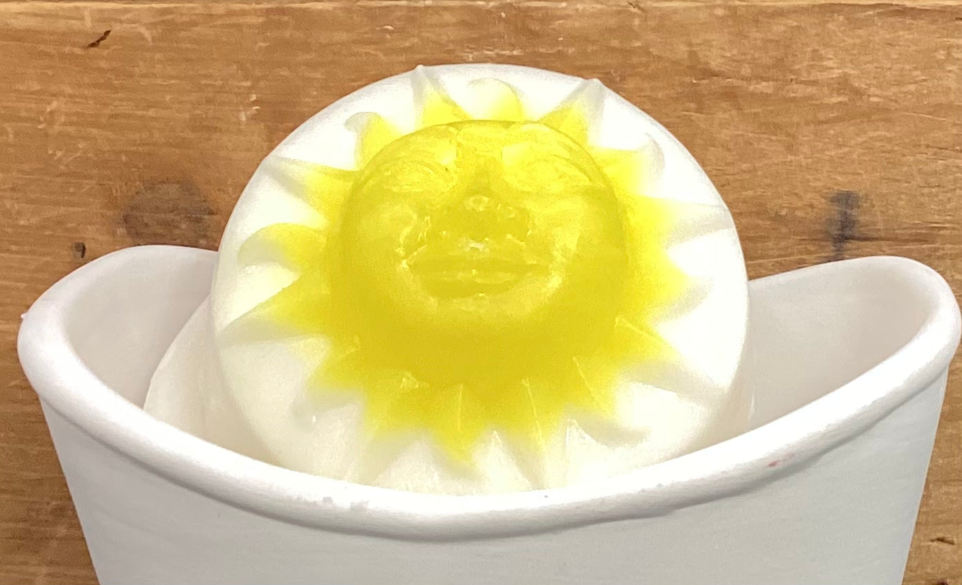 Honolulu Sun scented Shea Butter Soap in the shape of a sun