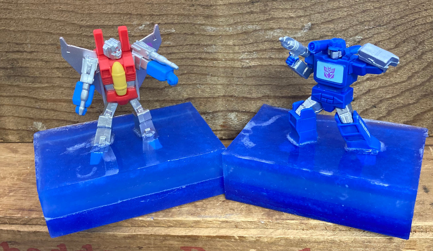 Transformer Toy atop a bar of Monkey Farts scented Glycerin soap.  These would make great birthday party favors!  $8 each  Each item is individually made and may appear different from the photo.  Toys may vary from photo.