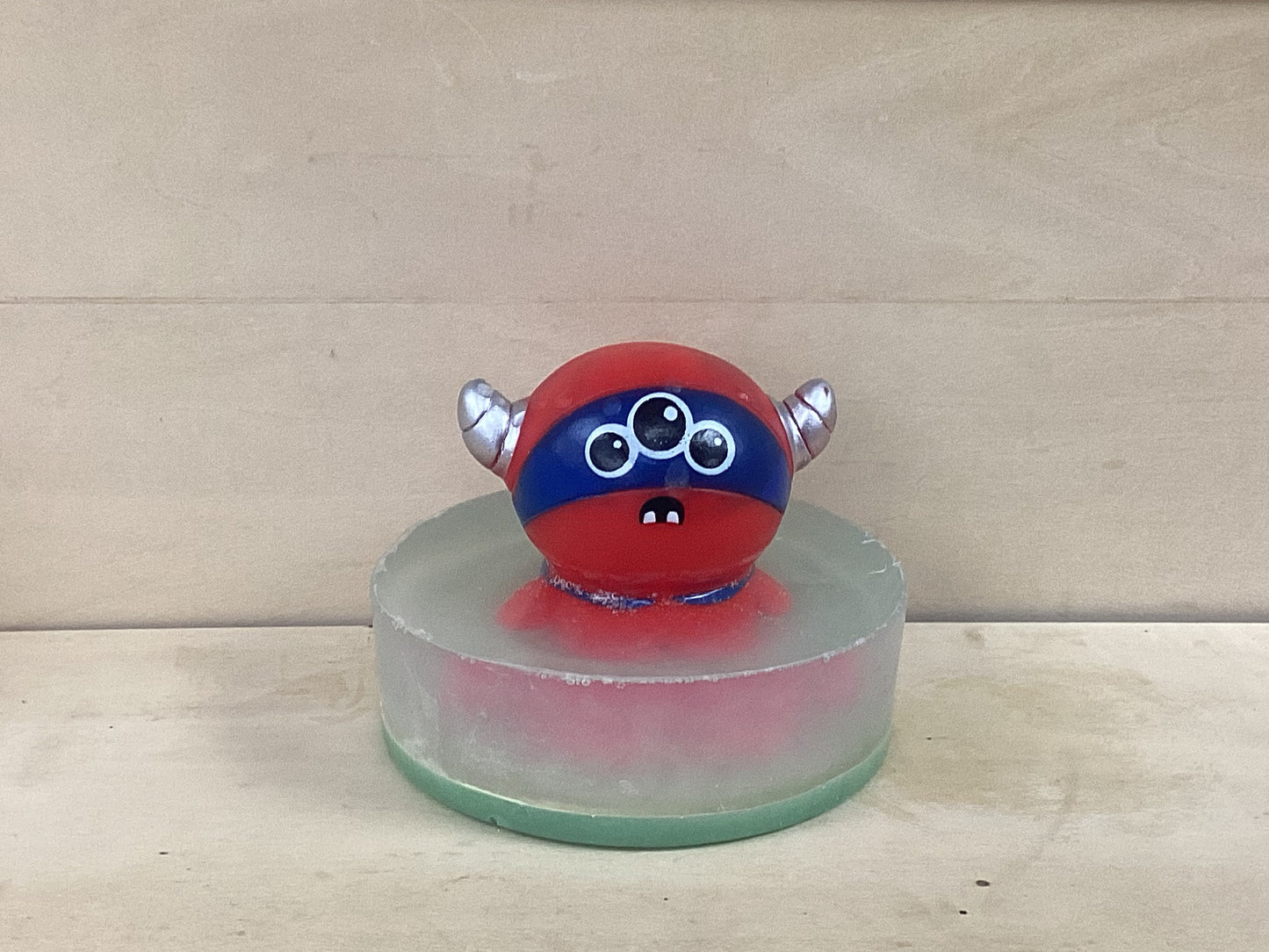 Ailen toy on a bar of glow in the dark soap
