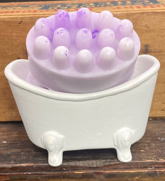 A soothing massage bar of Lilac-scented goat's milk soap.  This is the bar with the bumps that make a wonderful spa-like experience.  $7  Each item is individually created and may appear different from the photo.