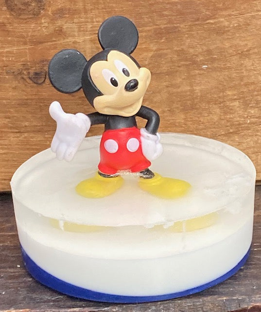 Mickey Mouse toy sits atop a bar of Candy Crush scented Shea Butter and Glycerin soap.    $8  Each item is individually made and may appear different from the photo.  Toys may appear different from photos.