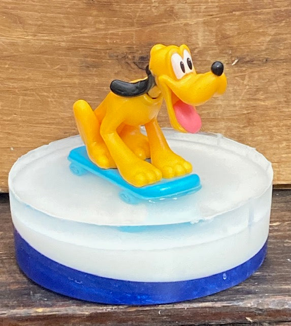 Pluto toy sits atop a bar of Candy Crush scented Shea Butter and Glycerin soap.    $8  Each item is individually made and may appear different from the photo.  Toys may appear different from photos.
