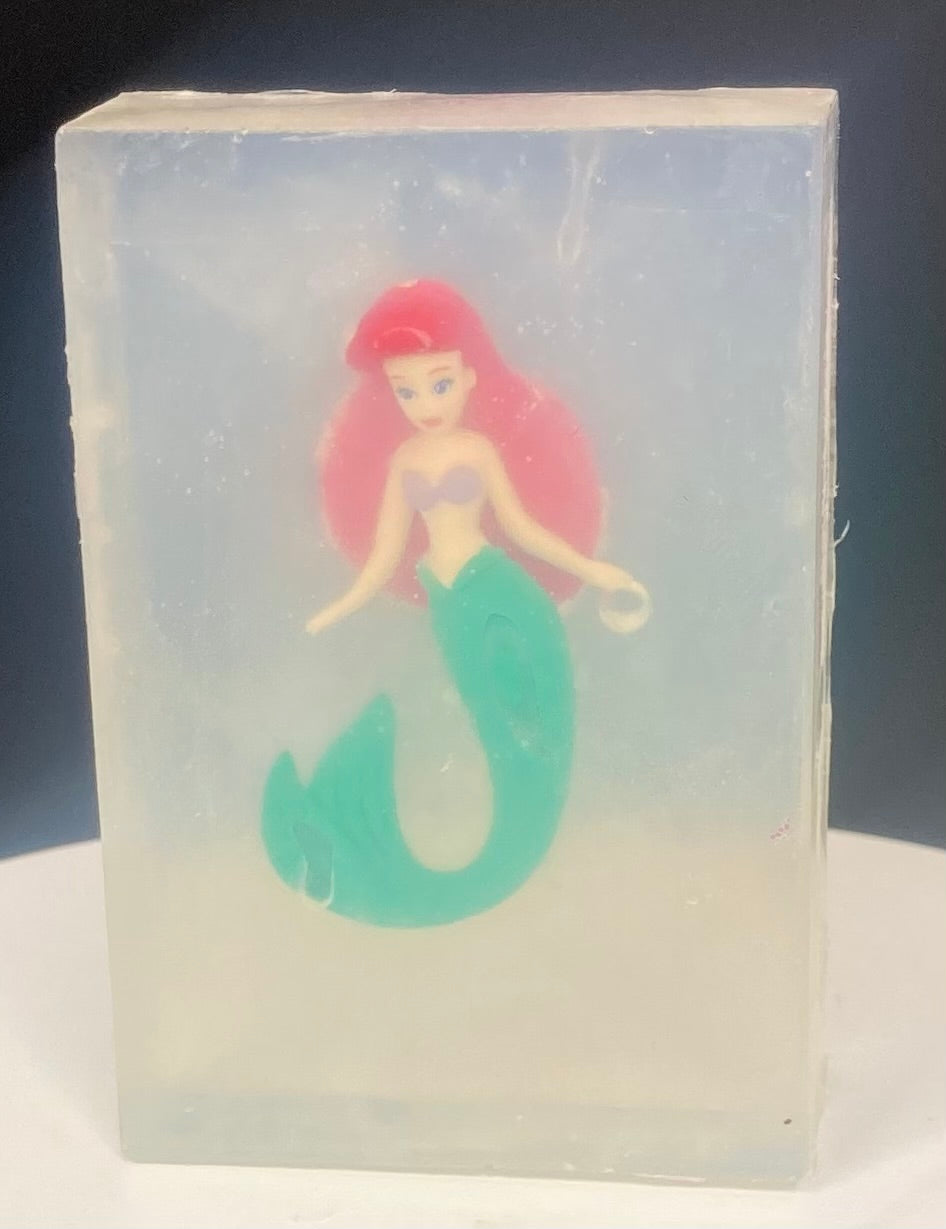 Ariel toy encased  in a bar of Lilac in Bloom scented Glycerin soap.