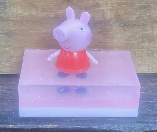 Peppa Pig sits atop a bar of Bubble Gum-scented Shea Butter and Glycerin soap.   $8  Each item is individually made and may appear different from the photo.