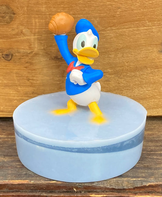 Donald Duck Toy on a Bar of Shea Butter and Glycerin Soap