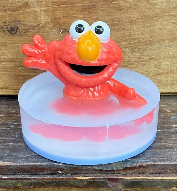  A cute red fuzzy monster atop a bar of Candy Crush scented Shea Butter and Glycerin soap.  $8  Each item is individually made and may appear different from the photo.