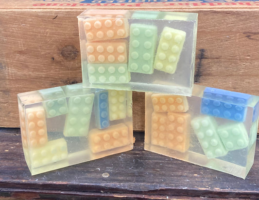 This is a bar of Monkey Farts scented glycerin soap embedded with Shea Butter Soap-shaped legos!  These would make an awesome addition to a birthday goody bag!   $7 each   Each item is individually made and may appear different from the photo.
