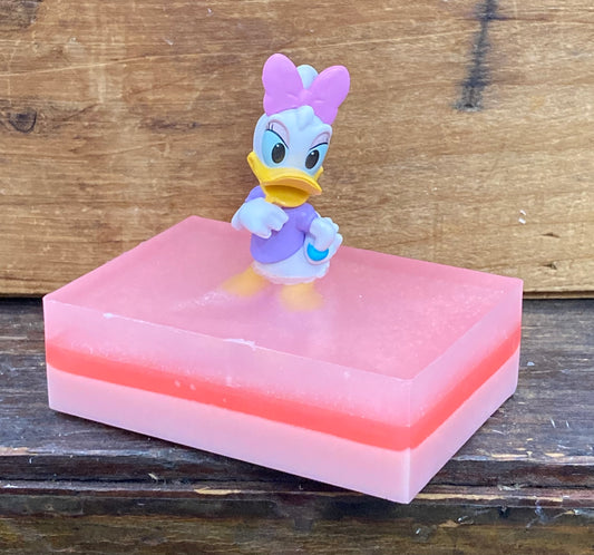 Daisey Duck Toy sits atop a bar of Bubble Gum scented Shea Butter and Glycerin soap.     $8  Each item is individually made and may appear different from the photo.
